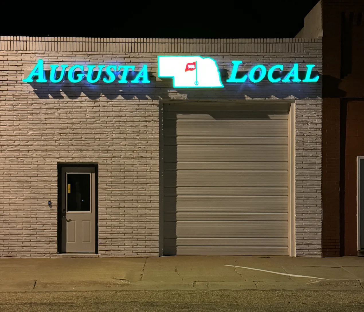 Augusta Local 308 lit up at night